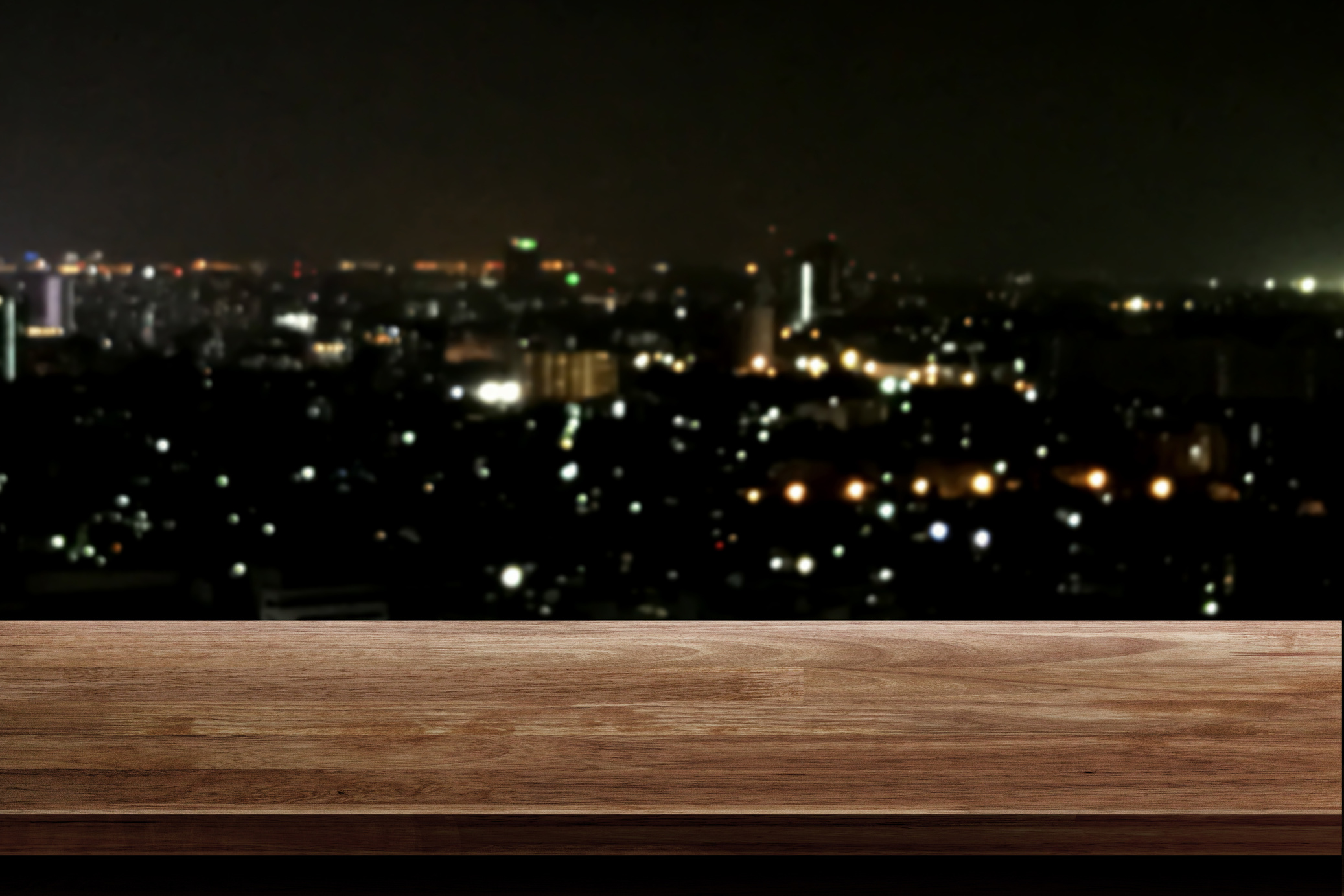 Wooden Table with Bokeh City Lights